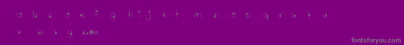 MtfWildflower-fontti – harmaat kirjasimet violetilla taustalla