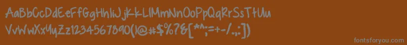 フォントKUASQUE – 茶色の背景に灰色の文字