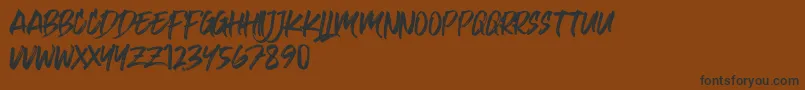Kulan Regular Font – Black Fonts on Brown Background