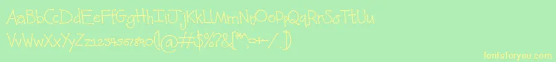 フォントKunette Kid Dot – 黄色の文字が緑の背景にあります