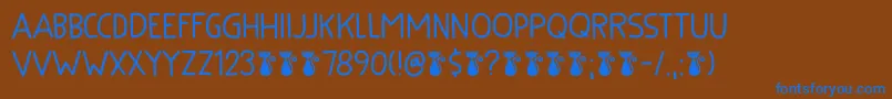 フォントKuroneko Kaps DEMO – 茶色の背景に青い文字