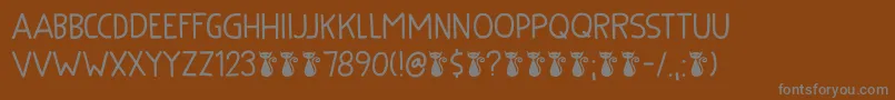 Kuroneko Kaps DEMO Font – Gray Fonts on Brown Background