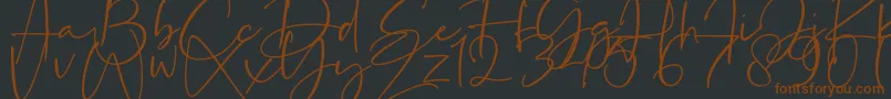 La Paloma-Schriftart – Braune Schriften auf schwarzem Hintergrund