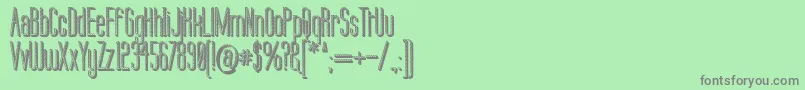 Fonte Labtop Candy Extra – fontes cinzas em um fundo verde