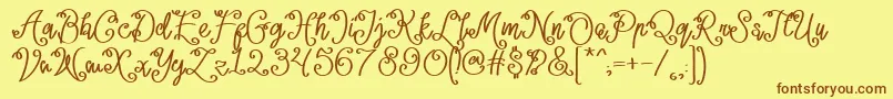 Lacoruna -Schriftart – Braune Schriften auf gelbem Hintergrund
