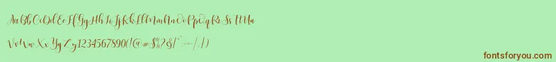 Fonte Ladies Script – fontes marrons em um fundo verde