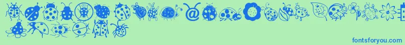 Ladybug Dings Font – Blue Fonts on Green Background