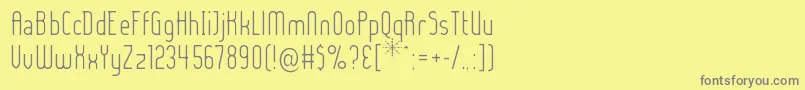 LADYIL  -Schriftart – Graue Schriften auf gelbem Hintergrund
