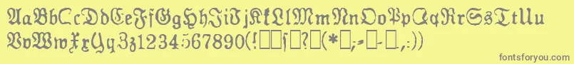 フォントGfGesetz – 黄色の背景に灰色の文字