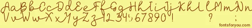 フォントlaksana – 茶色の文字が黄色の背景にあります。