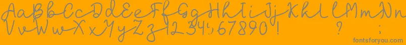 laksana-Schriftart – Graue Schriften auf orangefarbenem Hintergrund