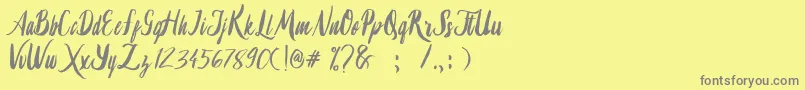 Lambaretta-fontti – harmaat kirjasimet keltaisella taustalla