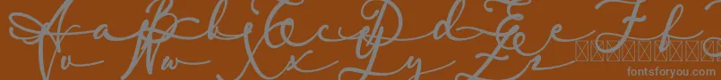 lambresia-fontti – harmaat kirjasimet ruskealla taustalla
