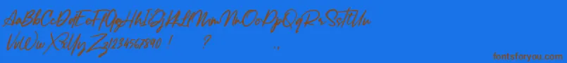 Fonte Lancaste Script Alt Demo – fontes marrons em um fundo azul