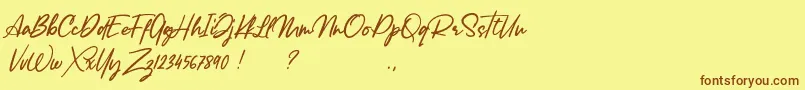 Fonte Lancaste Script Alt Demo – fontes marrons em um fundo amarelo