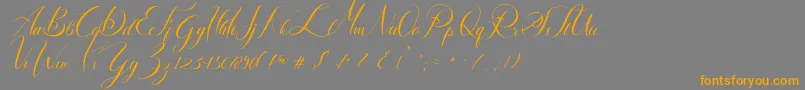 フォントLancelot – オレンジの文字は灰色の背景にあります。