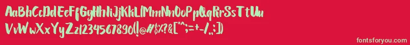 フォントLariess Personal use – 赤い背景に緑の文字