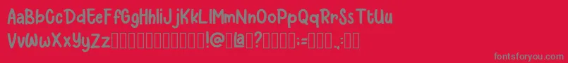 Czcionka Larys Manice Demo – szare czcionki na czerwonym tle