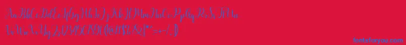 Latasha Script-Schriftart – Blaue Schriften auf rotem Hintergrund