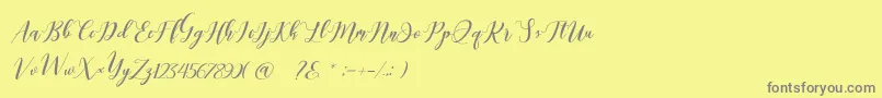 Latte coffee Script-Schriftart – Graue Schriften auf gelbem Hintergrund