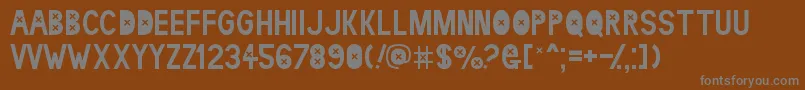フォントldr kaet – 茶色の背景に灰色の文字