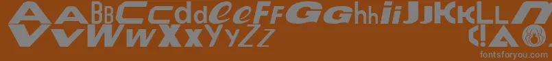 Fonte Le Tour de Fonts – fontes cinzas em um fundo marrom