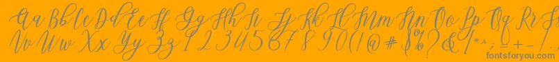 Leadent Script-Schriftart – Graue Schriften auf orangefarbenem Hintergrund