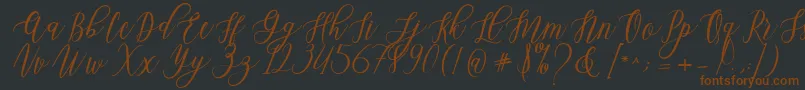 Шрифт Leadent Script – коричневые шрифты на чёрном фоне