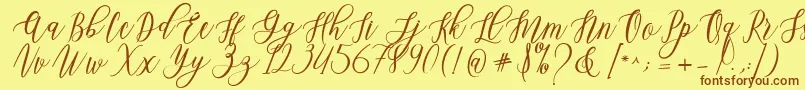 Fonte Leadent Script – fontes marrons em um fundo amarelo