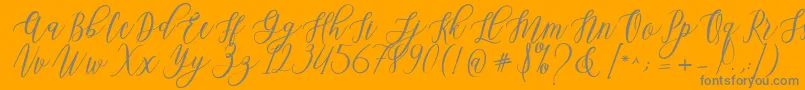 Leadent Script-Schriftart – Graue Schriften auf orangefarbenem Hintergrund