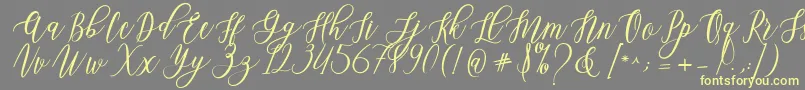 Leadent Script-Schriftart – Gelbe Schriften auf grauem Hintergrund