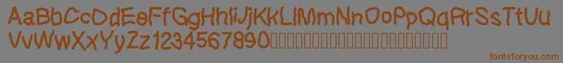 Шрифт Lefthandkids demo – коричневые шрифты на сером фоне