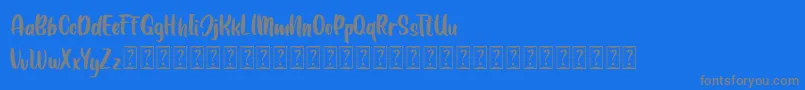 LEMONDAY Free-fontti – harmaat kirjasimet sinisellä taustalla