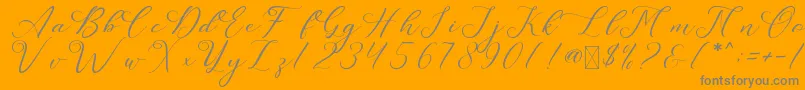 LeslieDawn-Schriftart – Graue Schriften auf orangefarbenem Hintergrund