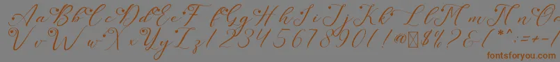 フォントLeslieDawnLove – 茶色の文字が灰色の背景にあります。