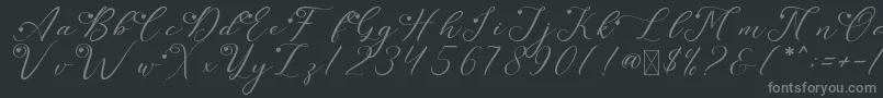 LeslieDawnLove-fontti – harmaat kirjasimet mustalla taustalla