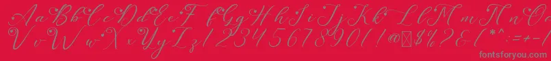 LeslieDawnLove-fontti – harmaat kirjasimet punaisella taustalla
