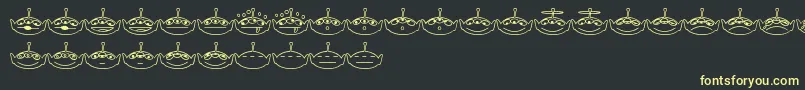 フォントAlienconsTwo – 黒い背景に黄色の文字