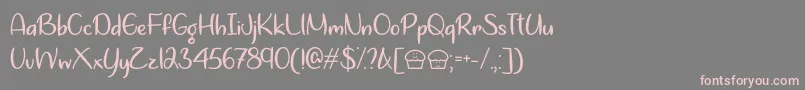 フォントLets Bake Muffins   – 灰色の背景にピンクのフォント
