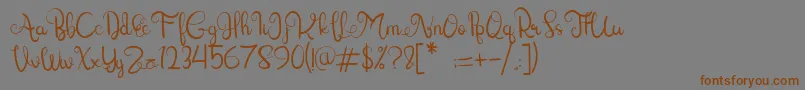 Lettering Script-Schriftart – Braune Schriften auf grauem Hintergrund