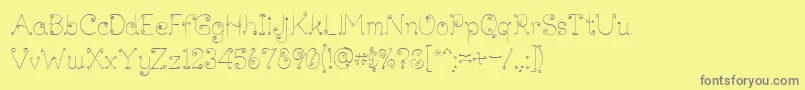 フォントLickcurl Petite – 黄色の背景に灰色の文字