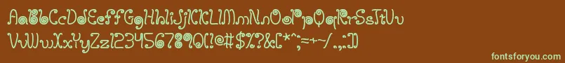 フォントlicostrg – 緑色の文字が茶色の背景にあります。