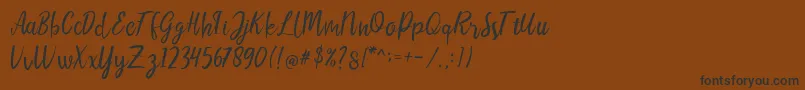 Шрифт LIONELLOSCRIPTRegular – чёрные шрифты на коричневом фоне