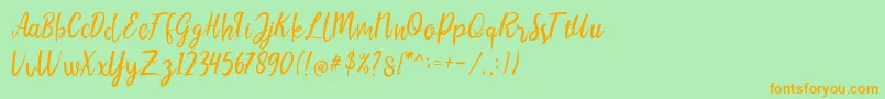 LIONELLOSCRIPTRegular Font – Orange Fonts on Green Background