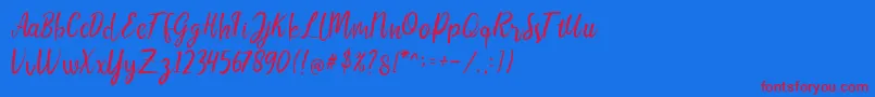LIONELLOSCRIPTRegular Font – Red Fonts on Blue Background