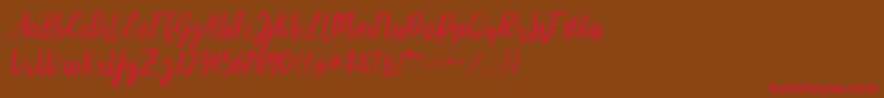 LIONELLOSCRIPTRegular Font – Red Fonts on Brown Background