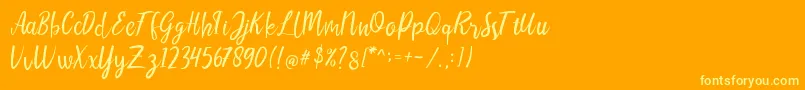 Шрифт LIONELLOSCRIPTRegular – жёлтые шрифты на оранжевом фоне