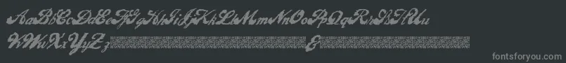 LiquidMagic-fontti – harmaat kirjasimet mustalla taustalla
