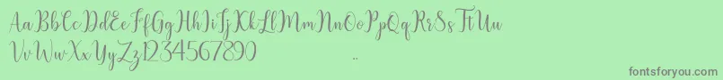 フォントlitesha – 緑の背景に灰色の文字
