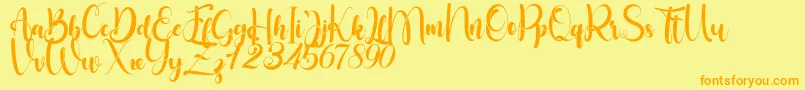 Fonte Little Betty – fontes laranjas em um fundo amarelo